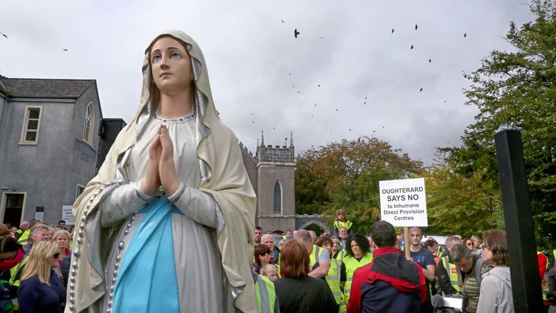 People gather for the silent protest march outside Oughterard church on Saturday. Photograph: Joe O’Shaughnessy.