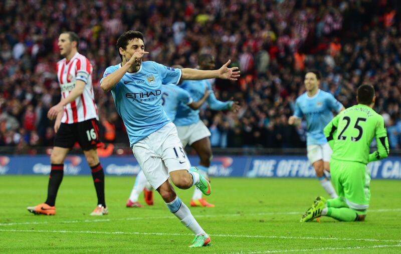 Jesus Navas of Manchester City celebrates after scoring his team's third goal during the 2014 League Cup final. File photograph: Jamie McDonald/Getty Images