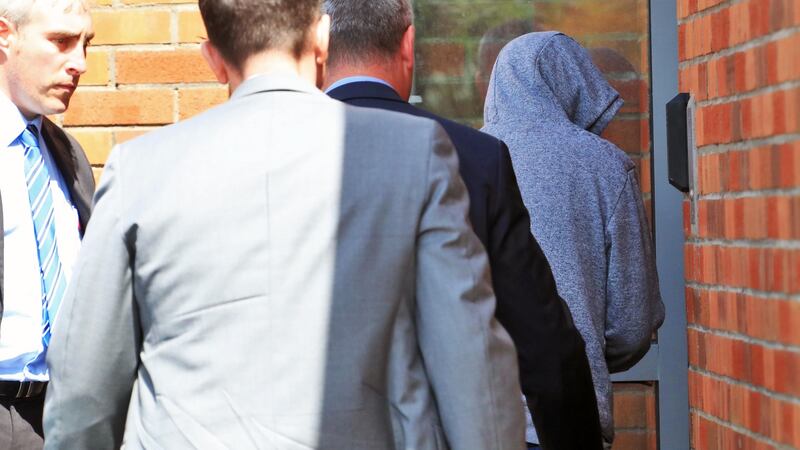 Kieran Greene (32) of Mountain View Park, Rathfarnham (in grey hoodie), being brought into Tallaght District Court this afternoon. Photograph: Colin Keegan/Collins Dublin