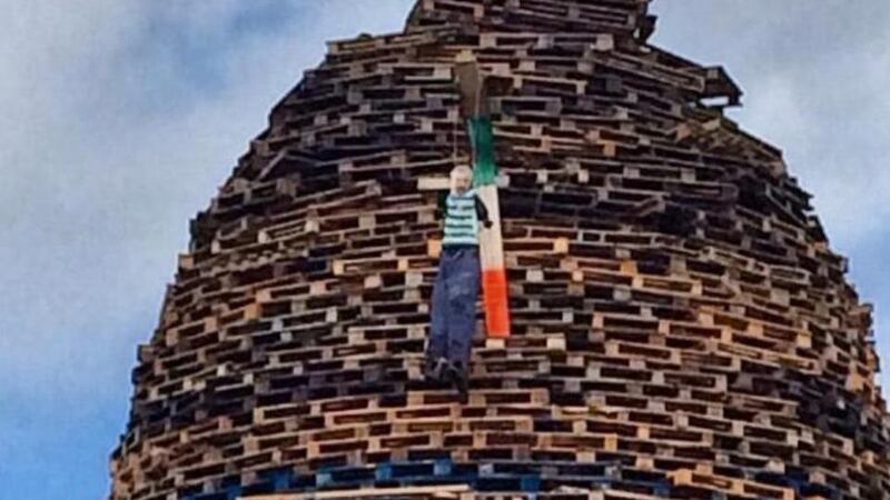 Sinn Féin president Gerry Adams has described the image of a lynched figure on a bonfire at Ballycraigy on the outskirts of Antrim Town as “deeply offensive and a clear hate crime by those responsible”.