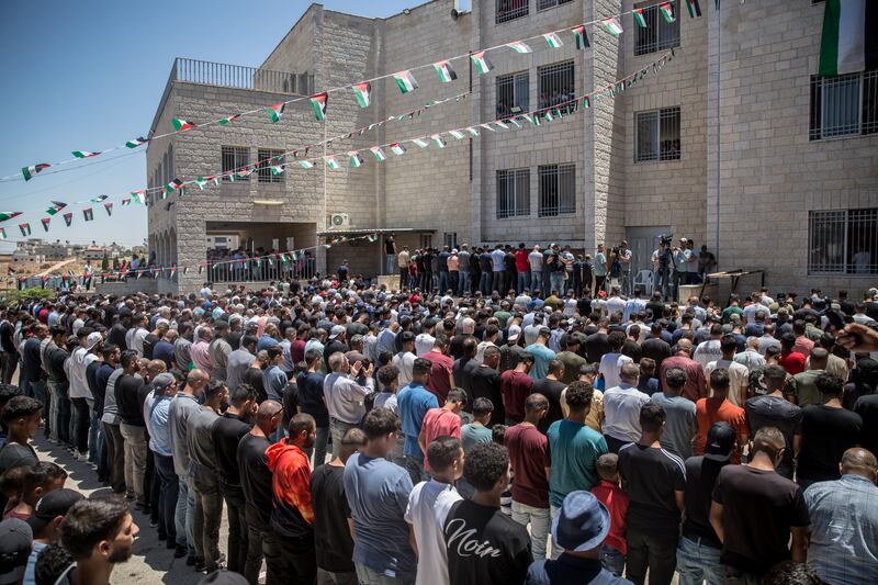 Men pray at the funeral for American citizen Sayfollah Musallet (20) and Palestinian Mohammed Hussein Al-Shalabi (23), in Al-Mazra’a ash-Sharqiya, the occupied West Bank. Photograph: Sally Hayden
