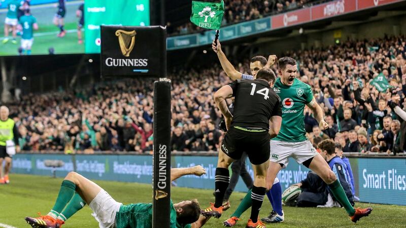 Sexton celebrates as Ben Smith of New Zealand is forced into touch last weekend. Photograph: Gary Carr/Inpho
