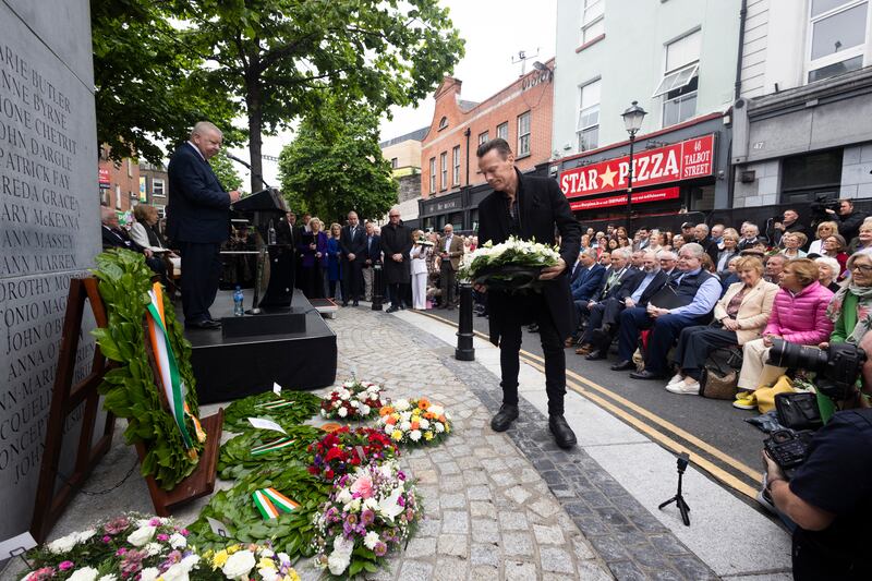 Larry Mullen laying a wreath at the memorial. Photograph: Sam Boal/Collins Photos


 