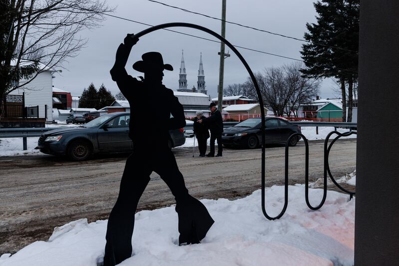A pair of elderly residents navigate an icy street in St-Tite, Quebec, Canada, in late November. The aging of the population has left a dearth of skilled labour in small towns across Quebec. Photograph: Nasuna Stuart-Ulin/New York Times