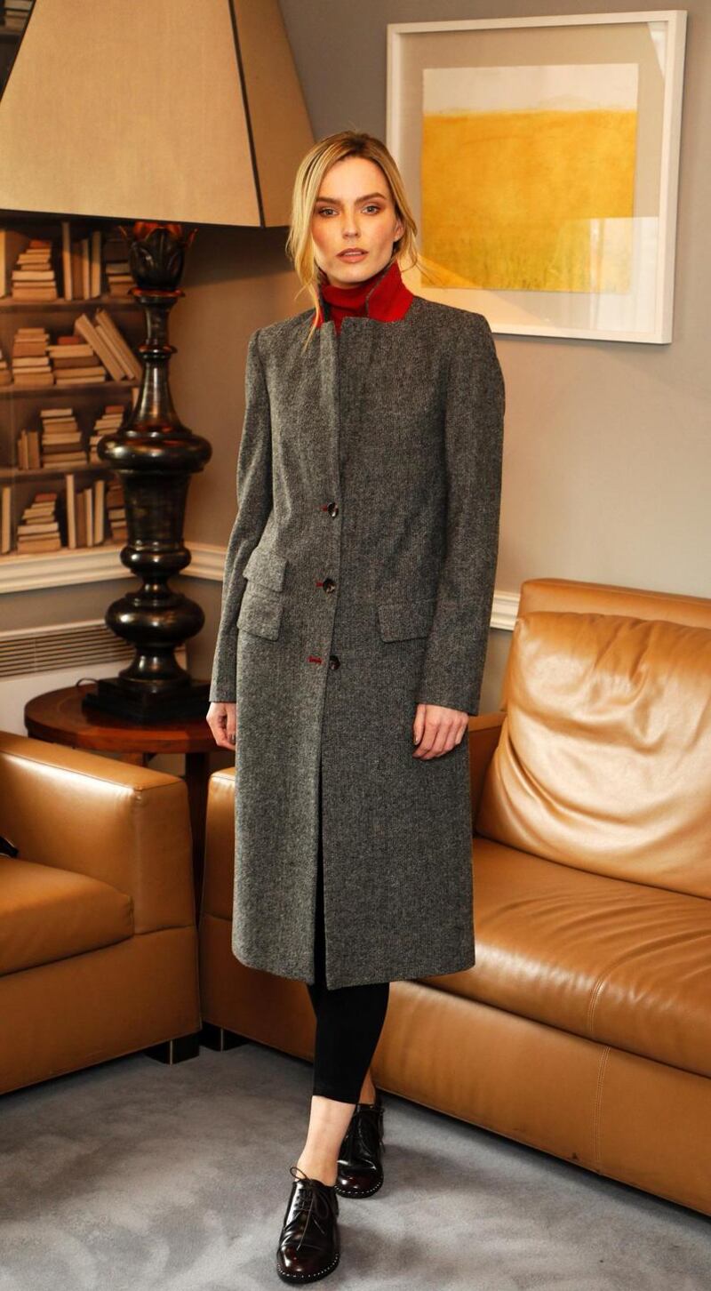 A stylish limited edition dogtooth print coat is available at  €95. The red polo neck sweater is €24, skinny black jeans €27 and the studded brogue shoes are €77. Photograph: Kieran Harnett