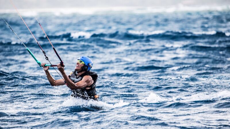 Barack Obama kitesurfing in the Caribbean. Photograph: Getty Images