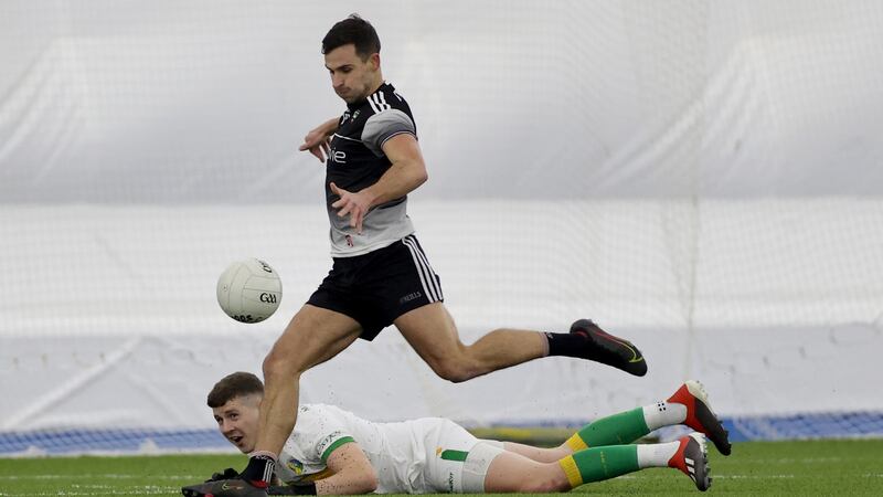 Sligo’s Niall Murphy scores his side’s opening goal despite goalkeeper Brendan Flynn of Leitrim. Photograph: James Crombie/Inpho