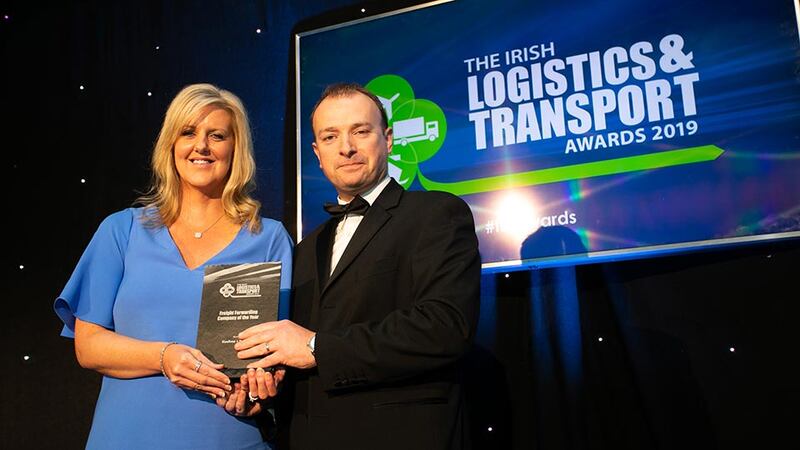 Conor Morgan, Head of Transport & Logistics, AIB Corporate Banking presents the Transport Company of the Year award to the NVD team.