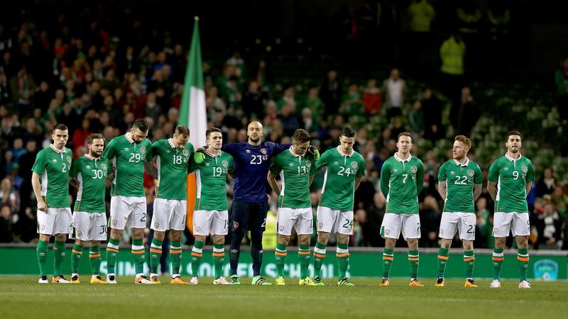 The Ireland team observe a minute’s silence before the game against Switzerland.