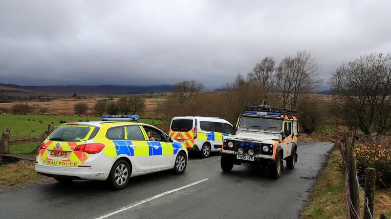 Police vehicles in Trawsfynydd, North Wales, where the  Twin Squirrel helicopter  went missing  while flying to Dublin. Photograph: Peter Byrne/PA Wire