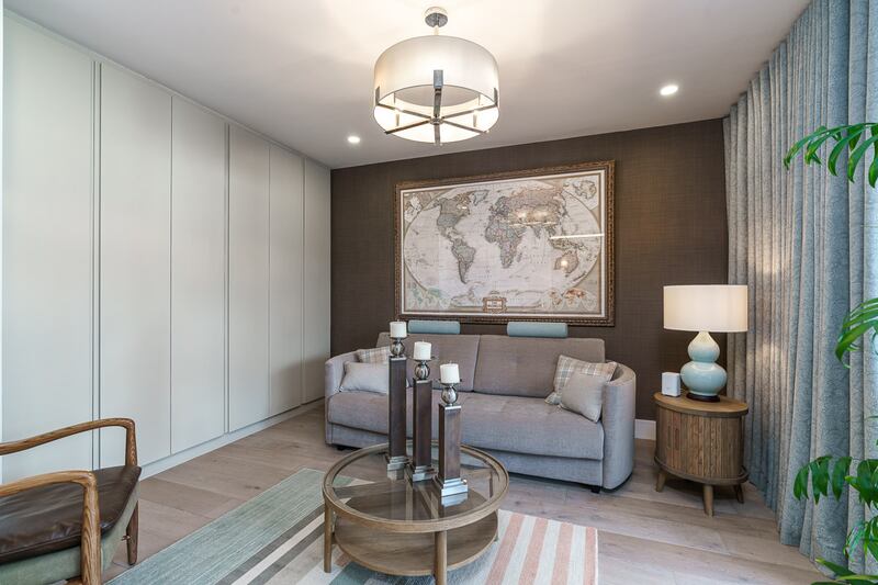 The ground-floor bedroom is laid out as an extra living space.