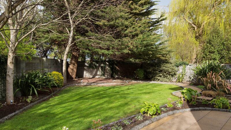 The back garden is laid out mainly in lawn and has three separate patio areas