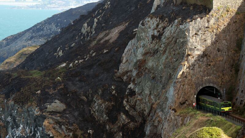 The Dart from Greystones passing throug a tunnel at Bray Head as wildfires scortched the landscape on the cliff walk between Bray and Greystones, Co Wicklow. Photograph: Nick Bradshaw