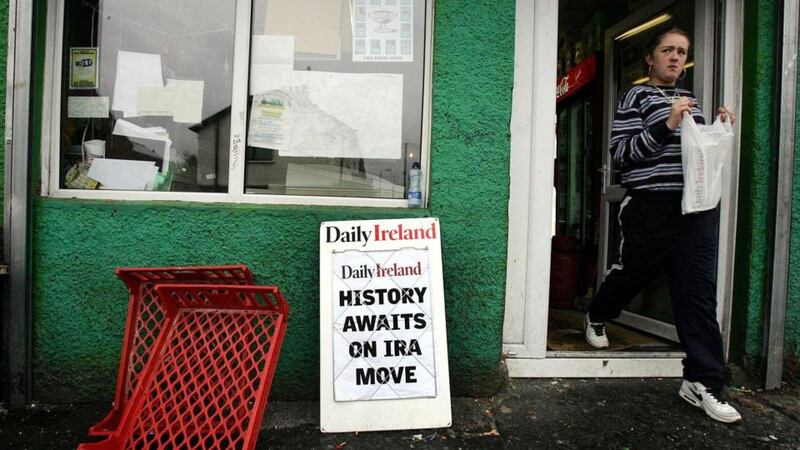 A billboard on the nationalist Falls Road in west Belfast Thursday July 28th, 2005, as the IRA called on all its members to stand down from 4pm its armed campaign. Photograph: Cathal McNaughton/PA.
