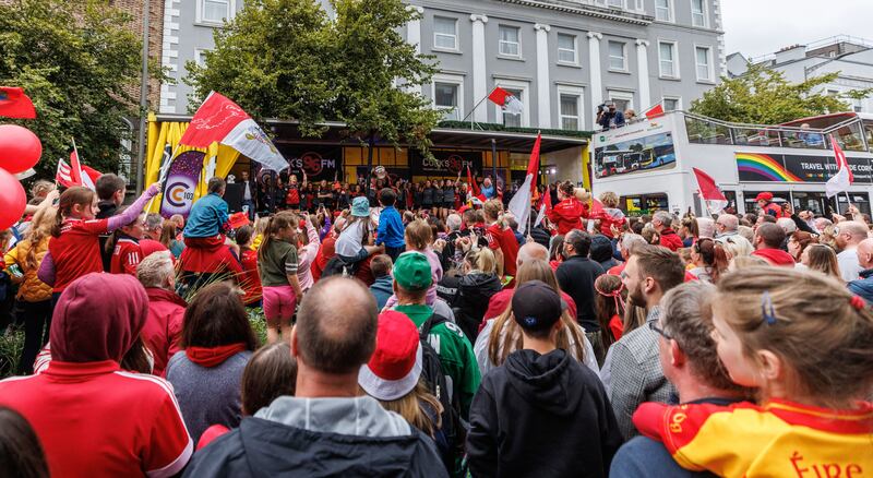 Cork's camogie champions parade through their home city with the O’Duffy Cup. Photograph: James Crombie/Inpho
