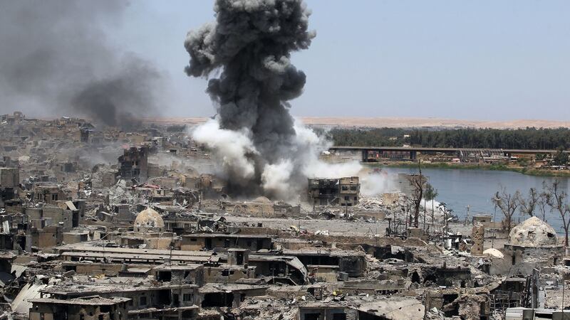 Smoke rises over Mosul following an airstrike by US-led international coalition forces targeting Islamic State. Photograph: AFP/Getty Images