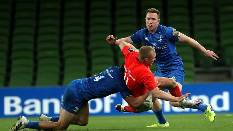 Leinster’s Hugo Keenan and Rory O’Loughlin tackle Keith Earls of Munster during the Guinness Pro 14 semi-final at the Aviva Stadium. Photograph: James Crombie/Inpho