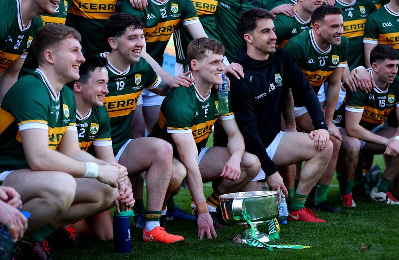 Gavin White and his Kerry team-mates celebrate with the Corn Mhichíl Uí Mhuircheartaigh after the game. Photograph: Ryan Byrne/Inpho