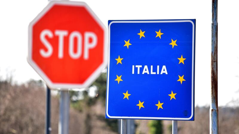 A sign hangs at the closed border point etween Slovenia and Italy. Photograph: Igor Kupljenik/EPA