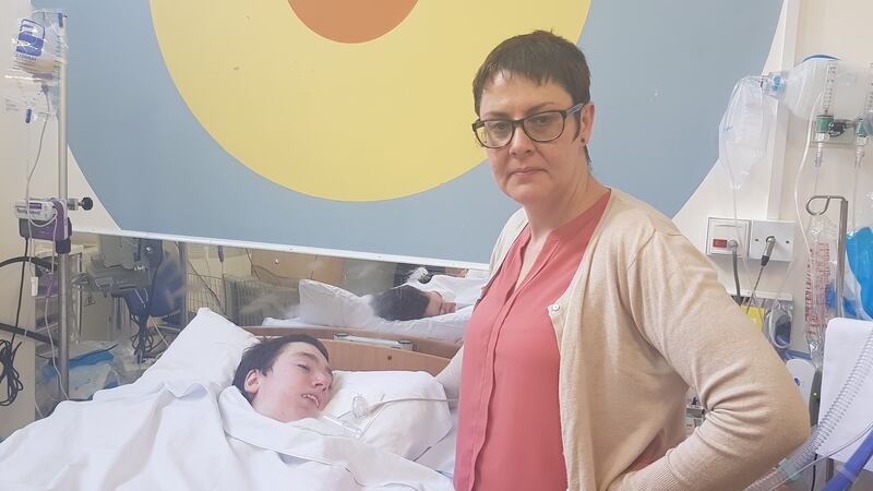 Muriel Slevin with her son, Morgan D’Arcy, in Crumlin children’s hospital. Morgan is unable to go home as he cannot get a homecare package.