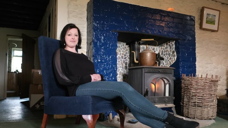 Abi Dillon in the living room of Mermaid Cottage near Dingle, Co Kerry
