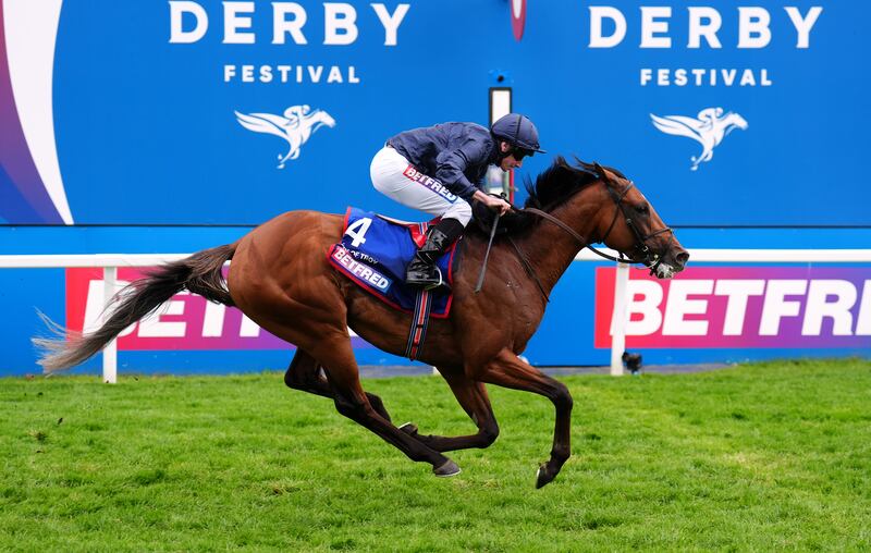 City Of Troy ridden by Ryan Moore on their way to winning the Epsom Derby. Photograph: PA