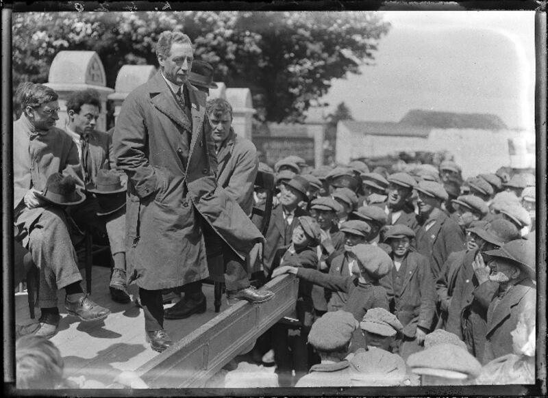 An election rally outside the church at Mooncoin on Monday,  June 12th, 1922, where 1916 veteran Cathal Brugha is making a speech with Éamon de Valera seated behind. Brugha died three weeks later following a clash with Free State forces in Dublin after the outbreak of the Civil War. Photograph:  National Library of Ireland