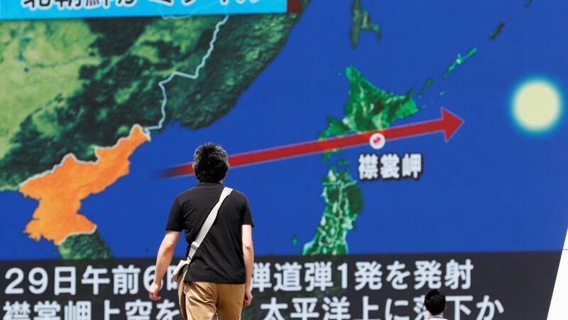 North Korea launched a ballistic missile over Japan that crashed in the Pacific Ocean, 1,180km east of Hokkaido’s Cape Erimo. No damage has been reported. The Japanese government issued a warning to its citizens after the launch. Photograph:  EPA