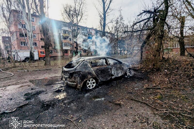 A burned car and damaged residential buildings in Kryvyi Rih following last Friday's Russian air strike. Photograph: Ukrainian Emergency Service/AP