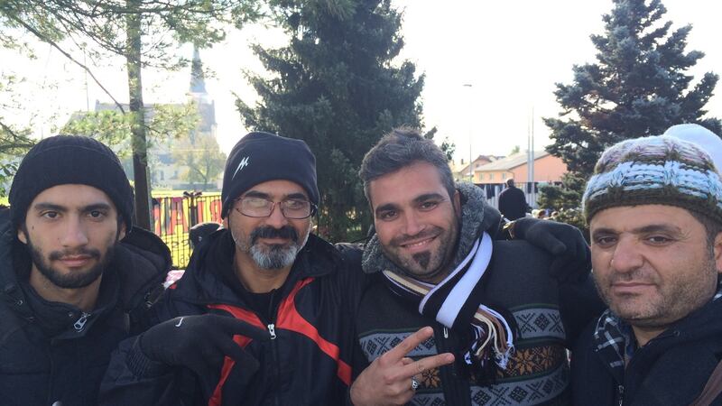 Left to right: Ermia, Amin, Mehdi and Iraj, all from Iran, at a makeshift migrants’ camp at Dobovo, Slovenia. Photograph: Daniel McLaughlin