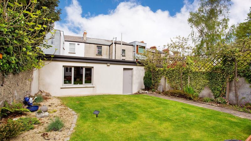At the end of the unfussy garden is a large block-built garage that is currently used as a gym