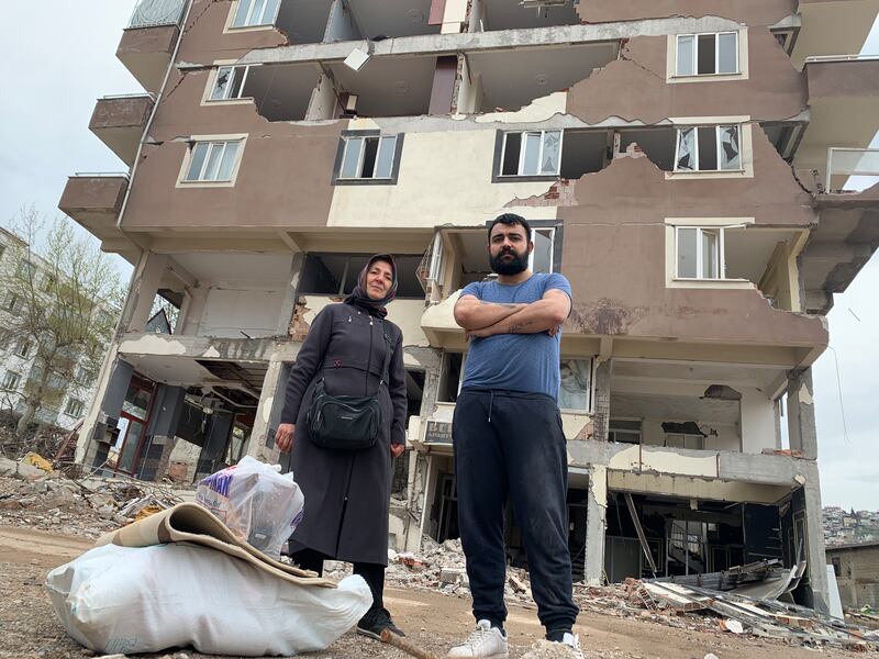 Alper Nedirli and his mother Sevim with their possessions, just retrieved from their second-floor flat in the Şazi Bey neighbourhood of Kahramanmaraş.  Photograph: Lorraine Mallinder