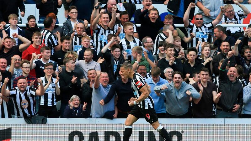 Dwight Gayle celebrates scoring Newcastle’s opener aganist Chelsea. Photograph: Lindsey Parnaby/AFP