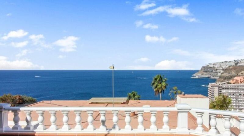 This furnished house in Los Caideros, Gran Canaria,  opens to a large terrace with sea views