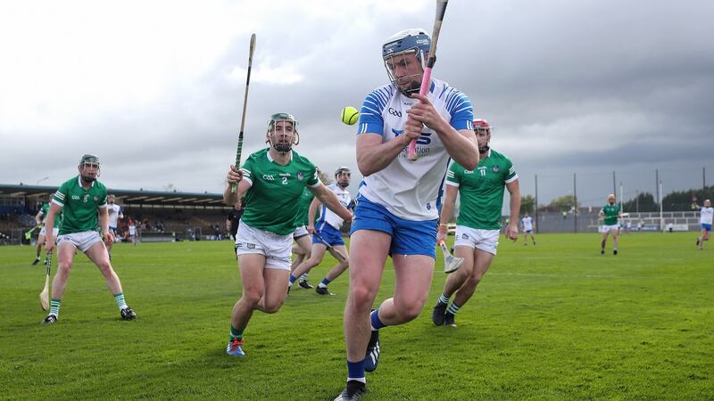 Waterford’s Stephen Bennett is closed down by Limerick’s Sean Finn. Photograph: Laszlo Geczo/Inpho
