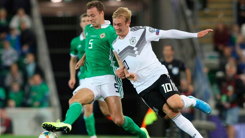 Northern Ireland defender Jonny Evans and Germany midfielder Julian Brandt. Photograph: Paul Faith/AFP/Getty