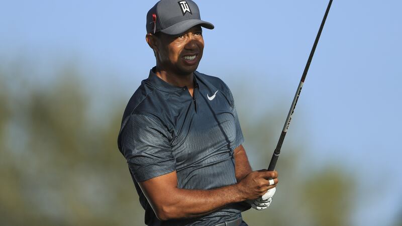 Tiger Woods plays a tee shot at 14th hole during the first round of the Honda Classic. Photograph:  Sam Greenwood/Getty Images