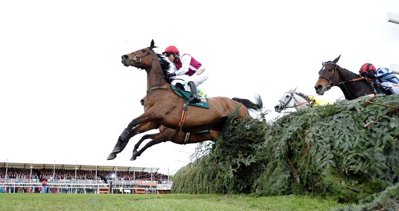 Seabass ridden by Katie Walsh  leads at the final fence before losing to Neptune Collonges ridden by Daryl Jacob  during the Grand National horse race at Aintree Racecourse in Liverpool, in April  2012. Photograph:  Paul Ellis/AFP/Getty Images