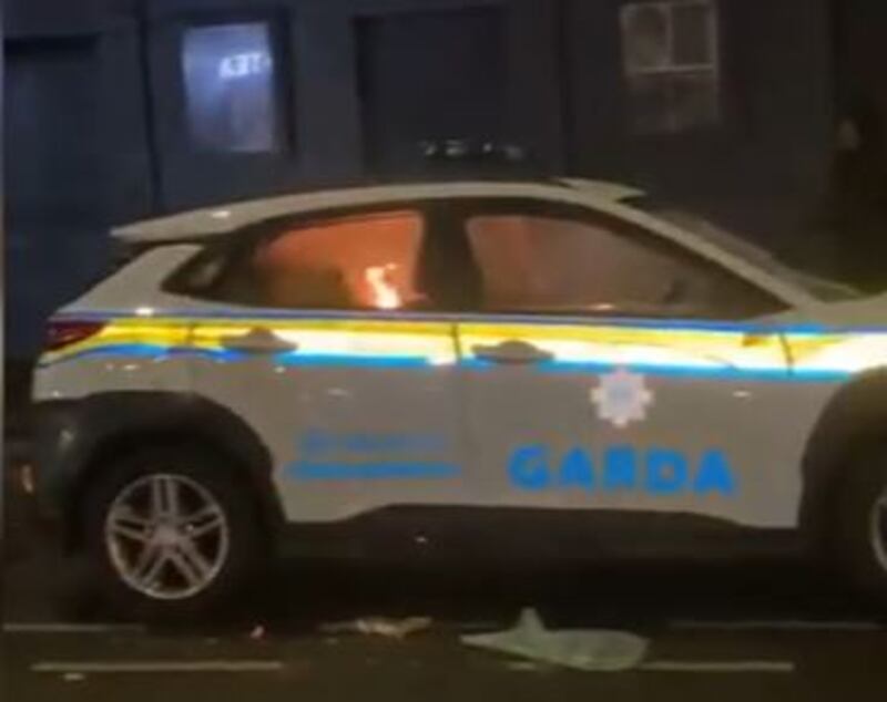 The Garda car set alight during the Dublin riots in November 2023.