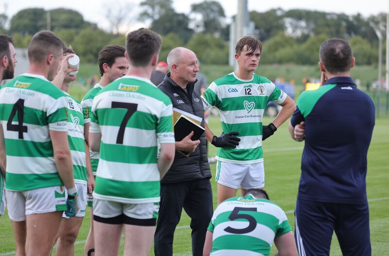 Jim Galvin explaining experimental rules to Round Towers players. Photograph: Alan Betson 


