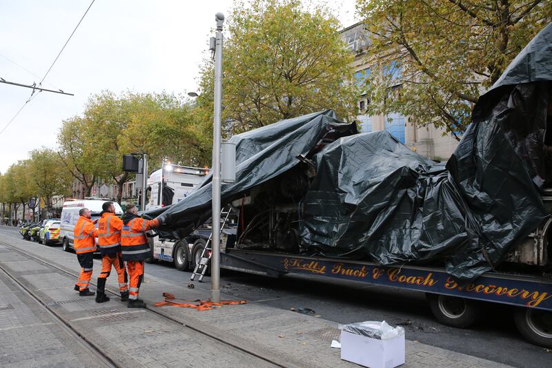 A burned out Luas is removed from  Dublin' O'Connell Street. 
Photograph: Gareth Chaney/Collins Photos
