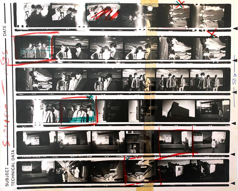 Using infrared film with red filters was all the rage when I was in college, and I thought it would be perfect to shoot my mate JP’s band The Switch early one morning in Dún Laoghaire. In my head I was Anton Corbijn shooting U2. The bottom half  of the contact shows photos from walkabout in Phibsborough. I see a garda wearing an old-fashioned heavy coat and a clockmaker shop that used to be on the corner of Dorset Street and Blessington Street. You might notice a piece of tape running from top to bottom. This was because I couldn’t afford 10in x 8in paper so would buy 5in x 7in and stick two sheets together