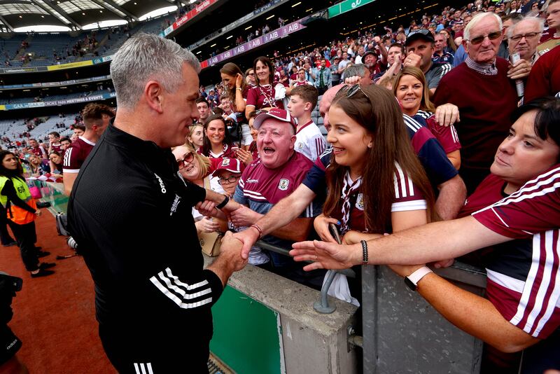 
Galway manager Padraic Joyce celebrates with his family after the victory over Derry at Croke Park. Photograph: Ryan Byrne/Inpho 