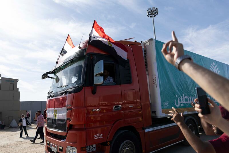 Aid convoy trucks cross the Rafah border into Gaza from the Egyptian side on Saturday.  The aid convoy was organised by a group of Egyptian NGOs. Photograph: Mahmoud Khaled/Getty Images