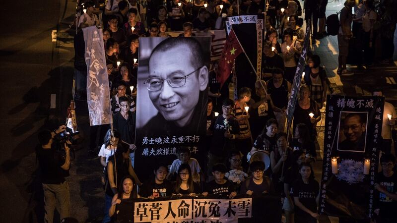 People attend a candlelight march for the late Chinese Nobel laureate Liu Xiaobo in Hong Kong on Saturday. Photograph: Getty