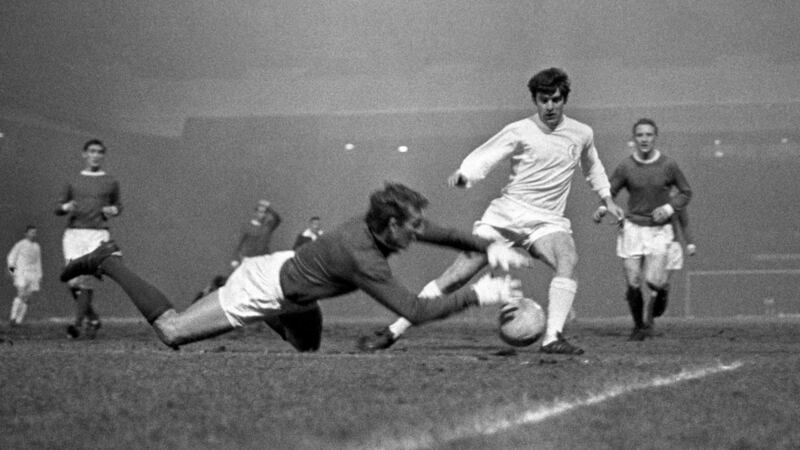 Manchester United goalkeeper Alex Stepney saves at the feet of Lorimer during a match in January 1970. Photo PA/PA Wire
