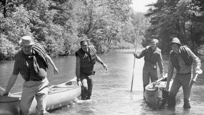 American actors Ned Beatty, Burt Reynolds, Jon Voight and Ronny Cox pull their canoes through the shallows of a river in a still from director John Boorman’s film ‘Deliverance’. Photograph: Warner Bros./Getty Images