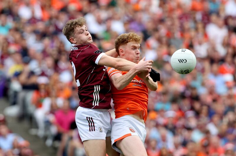 Galway's Johnny McGrath and Conor Turbitt of Armagh do battle in the All-Ireland Football Final. Photograph: Bryan Keane/Inpho