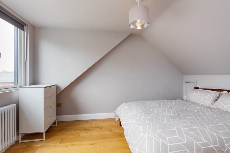 A fourth bedroom lies at attic level