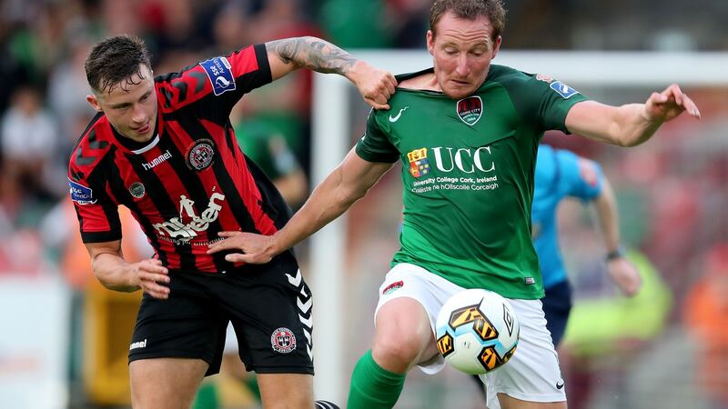 Achille Campion and Rob Cornwall fight for the ball on Monday night. Photograph: Inpho
